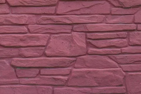 Masonry wall of red stone Stock Photos
