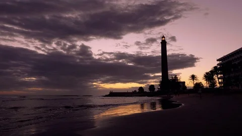 Maspalomas beach lighthouse at sunset. Stock Footage 97468203