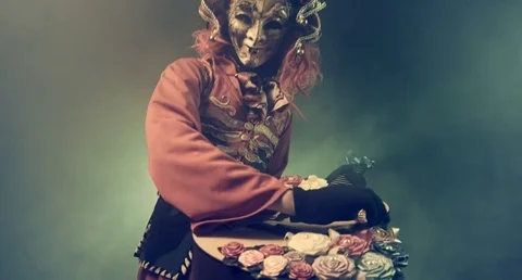 Masquerade. Actor in a Venetian costume playing the guitar. Romantic. Video stock 70977883
