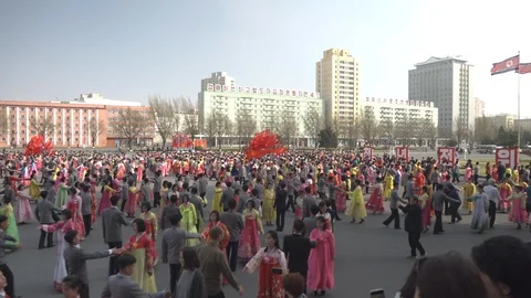 Mass dance at Day of the Sun in Pyongyang in Democratics Peoples Republic Video stock 107284540