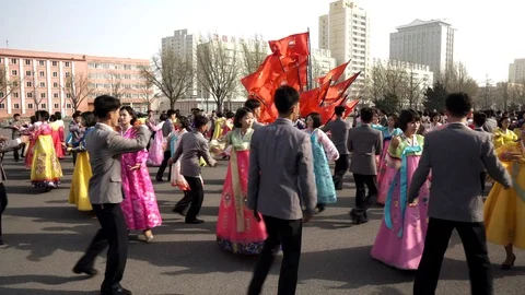 Mass dance at Day of the Sun in Pyongyang in Democratics Peoples Republic Stock Footage 107284547