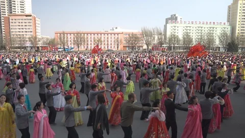 Mass dance at Day of the Sun in Pyongyang in Democratics Peoples Republic Video stock 107284554