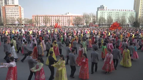 Mass dance at Day of the Sun in Pyongyang in Democratics Peoples Republic Video stock 107284661