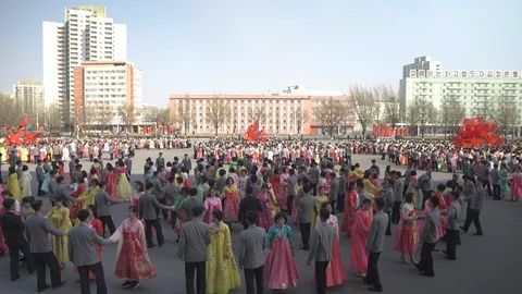 Mass dance at Day of the Sun in Pyongyang in Democratics Peoples Republic Video stock 107284669