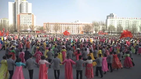Mass dance at Day of the Sun in Pyongyang in Democratics Peoples Republic Video stock 107284671