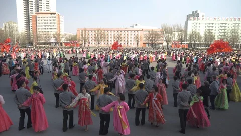 Mass dance at Day of the Sun in Pyongyang in Democratics Peoples Republic Video stock 107284672