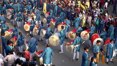 Mass drumming by cultural troops, Young people drumming during Ganpati Visarjan Stock Footage 301873628