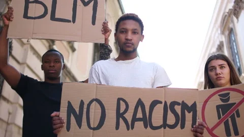Mass protests in the USA. Multiracial group of people with posters blm, police Stock Footage 133061000