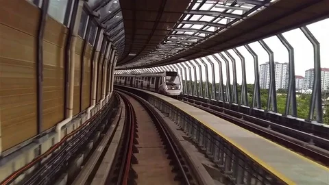 Mass Rapid Transit (MRT) commuter passing by on the railway. 스톡 동영상 80188364