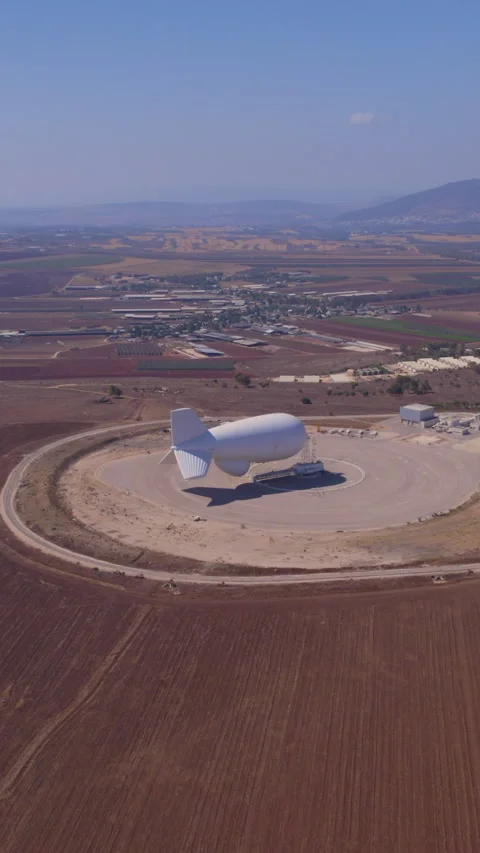Mass surveillance by Zeppelin balloon, captured in vertical video, raises Stock Footage 311903304