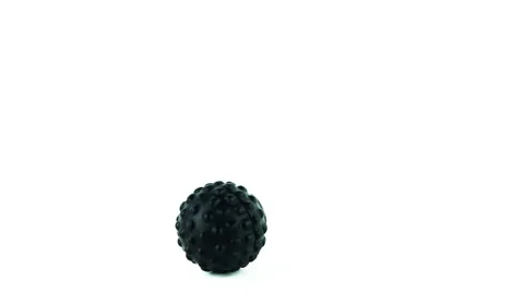 Massage ball rolling on the floor in white background. Stock Footage 135167798