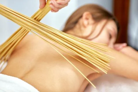 Massage with bamboo sticks Stock Photos