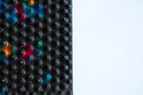 Massage Mat, applicator with sharp case needles close-up on a white backgroun 库存照片