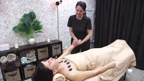 Massage parlor where procedures are carried out using hot stones Basalt Stock Footage 316240109