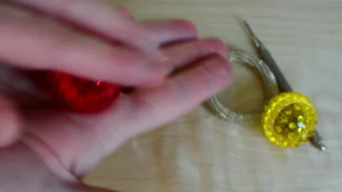 Massage the points of the palm according to the Su jok method using a red ball Stock Footage 148714199