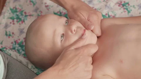 Massage professional therapist does for two years old baby boy child rehabili Stockbeeldmateriaal 111180288