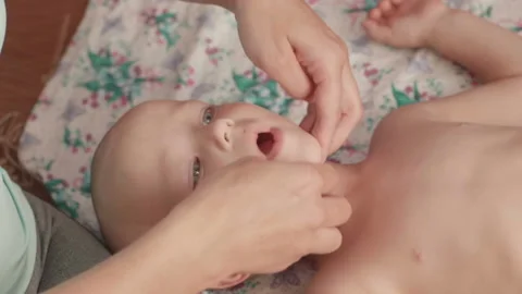 Massage professional therapist does for two years old baby boy child rehabili Stockbeeldmateriaal 111181512