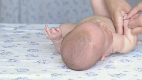 Massage professional therapist does for two month old baby girl child Stockbeeldmateriaal 111277613