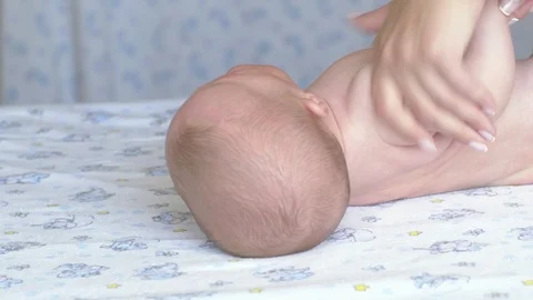 Massage professional therapist does for two month old baby girl child Stockbeeldmateriaal 111277664