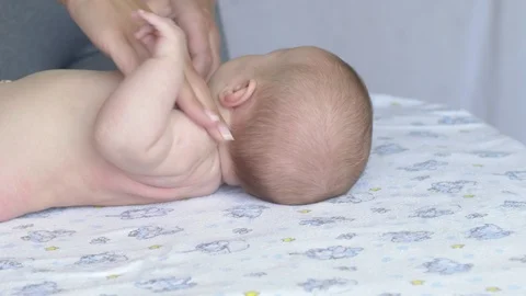 Massage professional therapist does for two month old baby girl child Stockbeeldmateriaal 111277666