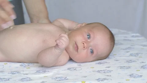 Massage professional therapist does for two month old baby girl child 스톡 동영상 111277734