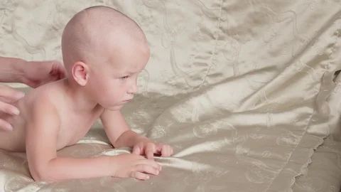 Massage professional therapist does for two years old baby boy child rehabili 스톡 동영상 118450412