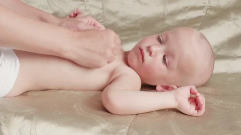 Massage professional therapist does for two years old baby boy child rehabili 스톡 동영상 118706838