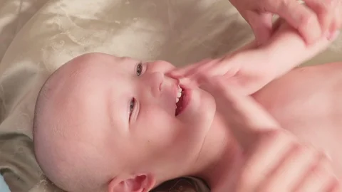 Massage professional therapist does for two years old baby boy child rehabili 스톡 동영상 118706900
