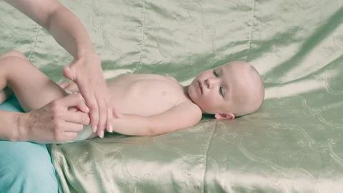 Massage professional therapist does for two years old baby boy child rehabili 스톡 동영상 119064419