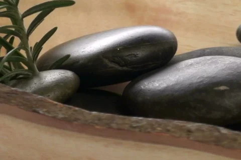 Massage rocks and herbs loop V2 - NTSC Stock Footage 668381