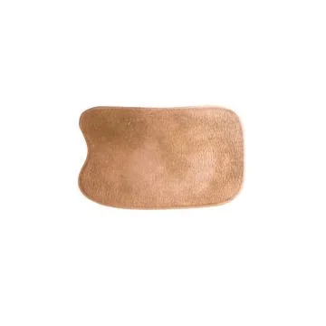 Massage scraper gua sha copper Stock Photos