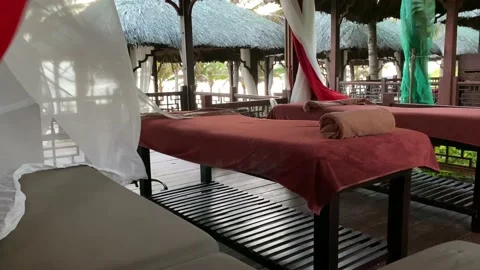 Massage table among palm trees Stock Footage 122842966