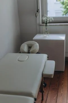 Massage table close-up. Massage table with headrest and hand rests. Stock Photos