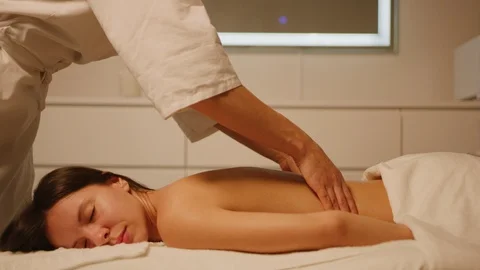 Massage therapist does relaxing back massage Stock Footage 126349968