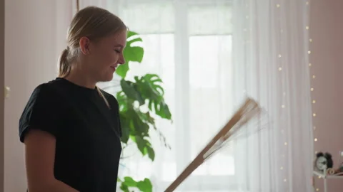 Massage Therapist Smiling While Performing Bamboo Broom Technique Stock Footage 309140439