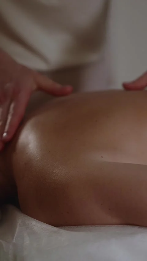 Massage therapy session in a quiet room at a wellness center Stock Footage 341281182