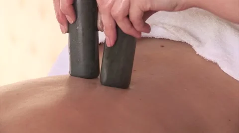 Massage with two stone sticks. 스톡 동영상 43078413