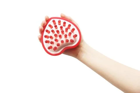 Massager in hand on a white background Stock Photos
