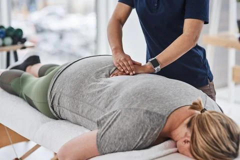 Massages make all the difference to tense muscles. a mature woman lying face Stock Photos