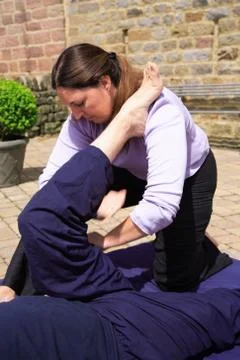 Massaging the hamstring Stock Photos