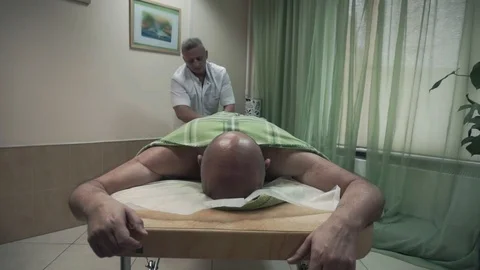 Massaging man leg Stock Footage 87825740