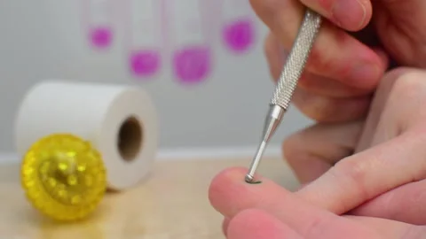 Massaging pain point according to the Su Jok technique using a probe Stock Footage 148714242