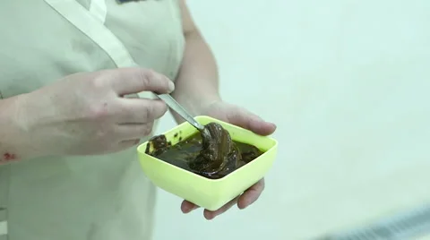 Massaging the skin using chocolate in a spa Stock-Footage 61449086