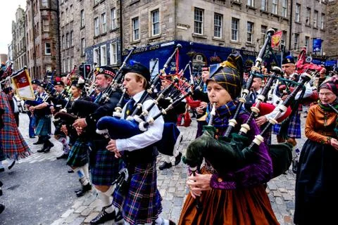 Massed Pipe Bands march down the Royal Mile in Edinburgh during the festival Stock Photos