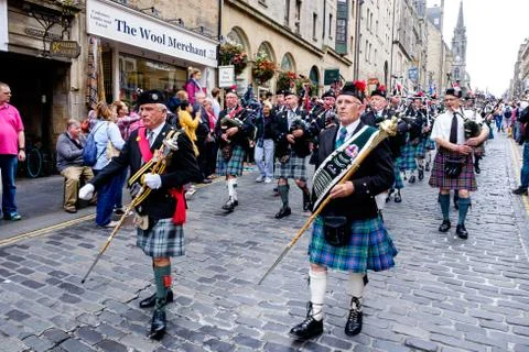 Massed Pipe Bands march down the Royal Mile in Edinburgh during the festival Stock Photos