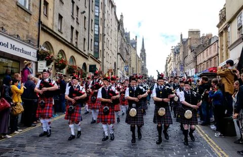 Massed Pipe Bands march down the Royal Mile in Edinburgh during the festival Stock Photos