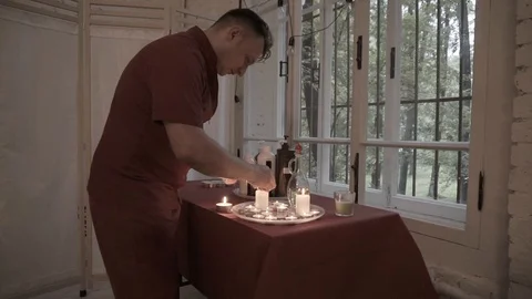 Masseur with candles Stock Footage 92127442