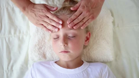 Masseur doing face massage to child. Stock Footage 158794682