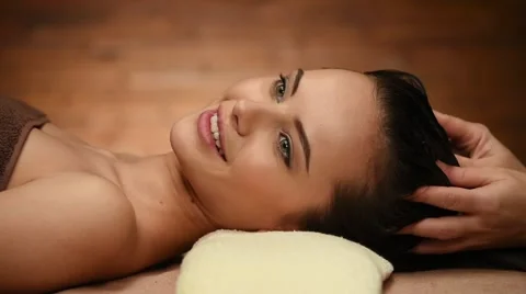 Masseur doing massage of the head and hairs for an woman in spa salon Stock Footage 47372745