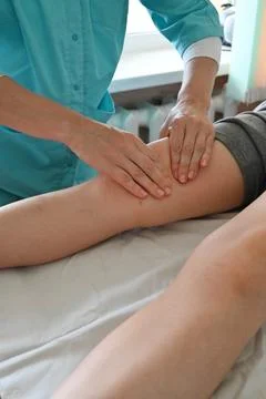 Masseur doing massage Stock Photos